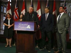 Gord Stringer speaks during a media conference at Queen's Park on Tuesday in front of, left to right, Nepea-Carleton MPP Lisa MacLeod, Kathleen Stringer, Concussion Legacy Foundation co-founder and CEO Chris Nowinski, CLF Canada executive director Tim Fleiszer. Jack Boland/Postmedia