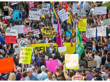 About 700 demonstrators listen to speeches, such as this one by Alex Neve of Amnesty International (C), as they took part in a noon time anti-racism protest in front of the US embassy in Ottawa. The peaceful demo was to voice their opinions against white supremacy and racism in all its forms.   Photo Wayne Cuddington/ Postmedia
Wayne Cuddington, Postmedia