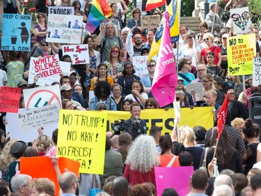 About 700 demonstrators listen to speeches as they took part in a noon time anti-racism protest in front of the US embassy in Ottawa. The peaceful demo was to voice their opinions against white supremacy and racism in all its forms.   Photo Wayne Cuddington/ Postmedia
Wayne Cuddington, Postmedia