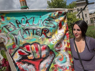 Artist Genevieve Langlois brought her large "Black Lives Matter" poster to join about 700 demonstrators taking part in a noon time anti-racism protest in front of the US embassy in Ottawa. The peaceful demo was to voice their opinions against white supremacy and racism in all its forms.   Photo Wayne Cuddington/ Postmedia
Wayne Cuddington, Postmedia