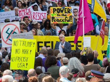 About 700 demonstrators listen to speeches, such as this one by Alex Neve of Amnesty International (C), as they took part in a noon time anti-racism protest in front of the US embassy in Ottawa. The peaceful demo was to voice their opinions against white supremacy and racism in all its forms.   Photo Wayne Cuddington/ Postmedia
Wayne Cuddington, Postmedia