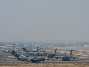 Smoke from the British Columbia, Canada wildfires, which has resulted in a burn ban for the Tacoma area, blankets the Joint Base Lewis-McChord flightline, Aug. 2,2017. The multiple fires have created pollution and visibility concerns for those participating in Mobility Guardian. More than 3,000 Airmen, Soldiers, Sailors, Marines and international partners converged on the state of Washington in support of Mobility Guardian. The exercise is intended to test the abilities of the Mobility Air Forces to execute rapid global mobility missions in dynamic, contested environments. Mobility Guardian is Air Mobility Command's premier exercise, providing an opportunity for the Mobility Air Forces to train with joint and international partners in airlift, air refueling, aeromedical evacuation and mobility support. The exercise is designed to sharpen Airmen’s skills in support of combatant commander requirements. (U.S. Air Force photo by Tech. Sgt. Jodi Martinez)