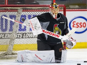 Andrew Hammond makes a stop during Senators practice last season.  Wayne Cuddington/ Postmedia