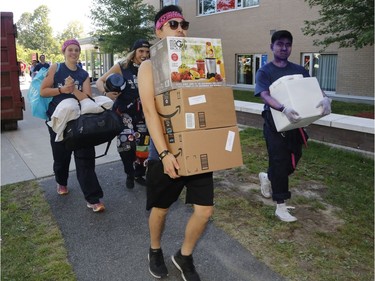 Students move into residence at Carleton University in Ottawa on Saturday, Sept. 2, 2017.