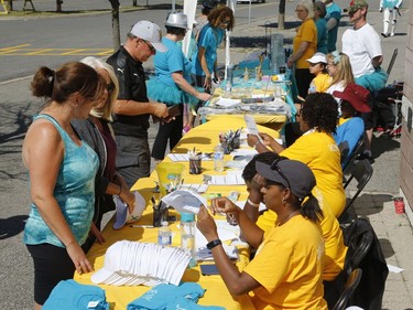 People register at the Teal Tailgate Party before the Ovarian Cancer Walk of Hope.