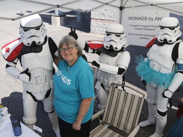 Ann Welbourn of Loretta Studios and Gallery poses with Star Wars characters at the Teal Tailgate Party before the Ovarian Cancer Walk of Hope.