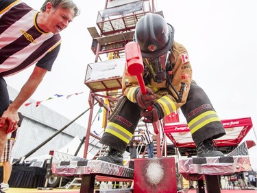 Madison Lavigne, from the Township of Wellesley Fire Department, competes in the opening heat.