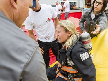 Kathryn Harding, from the Bruce Power Fire Department, shows her exhaustion after competing.