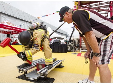 The Ottawa Fire Department's Keith Rigby, competes in the opening day of the FireFit championships.