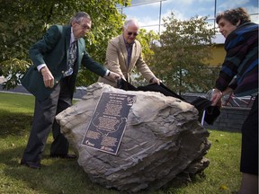 The Poets' Pathway unveiling in honour of William Pittman Lett (1819-1892) took place on Saturday, Sept. 9, 2017 at the James Bartleman Archives on Tallwood Drive. Great-grandchildren of William Pittman Lee, from left, Dr. Peter McLaine, William Pittman Lett III and Heather Steele, pull the cover off the plaque.