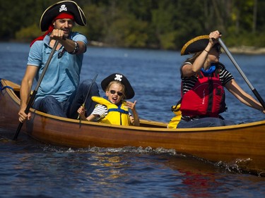 The Ottawa Riverkeeper held Ride the River family parade and picnic Sunday September 10, 2017. Various boats and boards were paddled down a stretch of the Ottawa River to celebrate the body of water that is the newest Canadian Heritage River. L-R Nicolas Moyer, five-year-old Saya Moyer and Sophie Cathelineau were dressed like pirates as they celebrate Nicolas's birthday by paddling down the river.