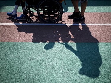 Members of the Ottawa Police Service paired up with the Miracle League of Ottawa to see who got to take home the Miracle League/Ottawa Police Service Game of Champions trophy in the second annual event at Miracle League Ballpark in Navan.