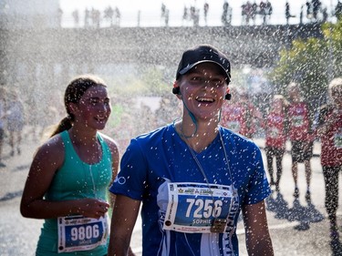 The 10th anniversary of the 2017 Canada Army Run took place Sunday, September 17, 2017 with 5K, 10K and half marathon races. Sophie Boucher cools off under a sprinkler of water after taking part in the Vimy Challenge.