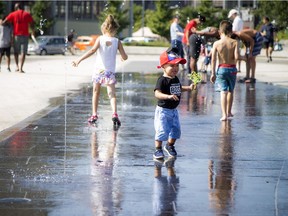 Ottawa set heat and humidity records Sunday and it's going to stay hot Monday and Tuesday. One-year-old Nayden cooled off at Lansdowne's water plaza Sunday September 24, 2017.   Ashley Fraser/Postmedia
Ashley Fraser, Postmedia