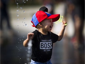 One-year-old Nayden cooled off at Lansdowne's water plaza Sunday September 24, 2017.