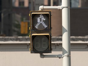 A walk signal at an Ottawa crosswalk.