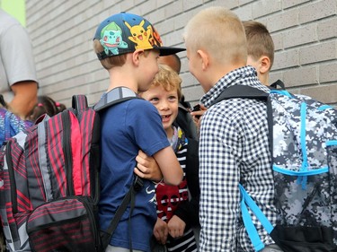 It was the first day back at school for kids in Ottawa's public board Tuesday (Sept. 5, 2017). However, for almost 600 children, it was their first day at a new school, Vimy Ridge Public School, which opened Tuesday in Findlay Creek and held an opening ceremony outside, complete with a flag raising and veteran bagpiper.  Julie Oliver/Postmedia
Julie Oliver, Postmedia