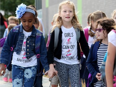 It was the first day back at school for kids in Ottawa's public board Tuesday (Sept. 5, 2017). However, for almost 600 children, it was their first day at a new school, Vimy Ridge Public School, which opened Tuesday in Findlay Creek and held an opening ceremony outside, complete with a flag raising and veteran bagpiper.  Julie Oliver/Postmedia
Julie Oliver, Postmedia