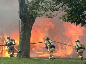 Firefighters battle a blaze in Ottawa in this 2017 file photo.