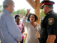 Mother of five Apolina Mahamba complains to Chief Charles Bordeleau (right) and city councillor Riley Brockington about the need for more security. About 100 Caldwell Avenue area residents showed up for a rally Wednesday afternoon following the shooting death of a young man in that neighbourhood last week. Many of the residents complained they need more security in the area.