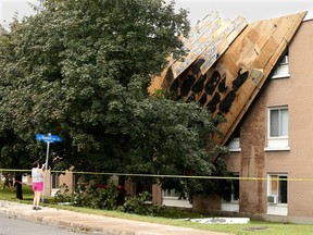 The roof was pulled off an apartment building on Carling Avenue when  a vicious storm blew through Wednesday afternoon, knocking trees down onto cars and houses.