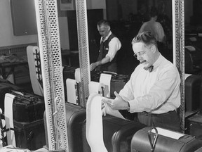 General manager of The Canadian Press Gillis (Gil) Purcell reads news stories off the wire at the news gathering co-operative offices in Toronto in this 1963 file photo. The Canadian Press, the national news service that was created during the First World War to bring home stories from the European front ‚Äî and went on to become the country&#039;s go-to, real-time source ‚Äî turned 100 Friday. But even dedicated news junkies might not know where to send a birthday card. Described by some scholars as