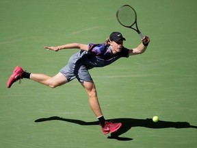 Denis Shapovalov, of Canada, returns a shot from Kyle Edmund, of Great Britain, during the third round of the U.S. Open tennis tournament, Friday, Sept. 1, 2017, in New York. (AP Photo/Seth Wenig)