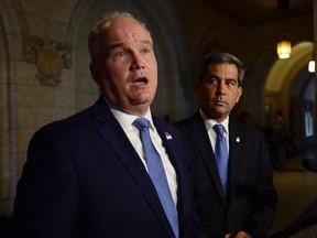 Conservative MP Erin O&#039;Toole talks to media outside the House of Commons on Parliament Hill, as Tory MP Pierre Paul-Hus looks on, in Ottawa on June 20, 2017. Attack mode, says the Conservative Party&#039;s new foreign affairs critic, will not be the opposition&#039;s first instinct when dealing with the Liberal government&#039;s renegotiation of the North American Free Trade Agreement. Conservative MP Erin O&#039;Toole says his party is willing to offer non-partisan support to the Liberal government during the cont