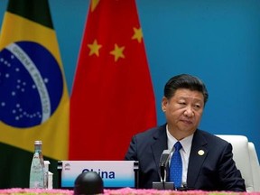 Chinese President Xi Jinping listens to a speech during the Dialogue of Emerging Market and Developing Countries in Xiamen in southeastern China&#039;s Fujian Province, Tuesday, Sept. 5, 2017. (AP Photo/Mark Schiefelbein, Pool)