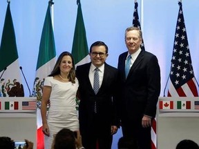 Canadian Foreign Affairs Minister Chrystia Freeland, from left, Mexico&#039;s Secretary of Economy Ildefonso Guajardo Villarreal, and U.S. Trade Representative Robert Lighthizer, pose for a group photo at a press conference regarding the second round of NAFTA renegotiations in Mexico City. Tuesday, Sept. 5, 2017.