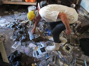 This Oct. 12, 2016 file photo shows, Walter Coker as he surveys the damage in his furniture storage shed in Crescent Beach, Fla. Coker runs Genung&#039;s Fish Camp and Marina on the shore of the Matanzas River, and saw storm surge from Hurricane Matthew run &ampquot;like a river&ampquot; through his property, tearing apart the storage shed and the tackle shop. He doesn&#039;t have flood insurance because he said it was too expensive. With Hurricane Irma bearing down on Florida, an Associated Press analysis shows that the