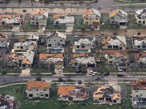 In this Aug. 25, 1992, file photo, rows of damaged houses sit between Homestead and Florida City, Fla., after Hurricane Andrew struck.  After a catastrophic Hurricane Andrew revealed how lax building codes had become in the country's most storm-prone state, Florida began requiring sturdier construction. Now, experts say a monstrously strong Hurricane Irma could become the most serious test of Florida's storm-worthiness since the 1992 disaster. (AP Photo/Mark Foley, File)