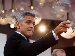 Actor George Clooney arrives on the red carpet of the film &ampquot;Suburbicon&ampquot; at the 74th Venice Film Festival in Venice, Italy, Saturday, Sept. 2, 2017. As George Clooney unveils his new film &ampquot;Suburbicon,&ampquot; about racial tensions in a white southern town in 1950, he says he feels a great sense of frustration and shame that the subject matter is so timely and that the U.S. is in a state of political upheaval. THE CANADIAN PRESS/AP, Domenico Stinellis