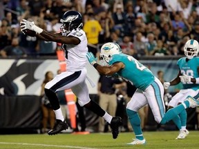 FILE - In this Aug. 24, 2017, file photo, Philadelphia Eagles&#039; Alshon Jeffery, left, scores a touchdown past Miami Dolphins&#039; Nate Allen during the first half of a preseason NFL football game in Philadelphia. Jeffery is looking forward to going against Washington Redskins cornerback Josh Norman, who likes to talk trash. He has 11 catches for 189 yards and a touchdown in two games against Norman. (AP Photo/Matt Rourke, File)