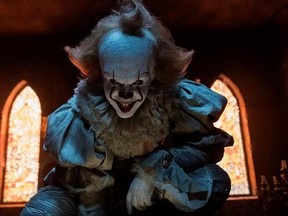 This image released by Warner Bros. Pictures shows Bill Skarsgard in a scene from &ampquot;It.&ampquot; (Brooke Palmer/Warner Bros. Pictures via AP)