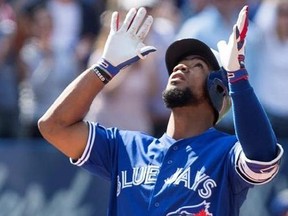 Toronto Blue Jays Teoscar Hernandez gestures as he approaches home plate after hitting a three-run homer off Detroit Tigers pitcher Anibal Sanchez during fifth inning Major League baseball action in Toronto on Sunday, September 10, 2017.