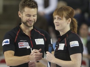 In this Jan. 10, 2015 file photo, Mike and Dawn McEwen celebrate during a Continental Cup mixed doubles match in Calgary.