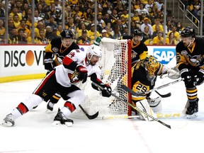 Senators forward Alex Burrows tries a wrap-around shot against Penguins goalie Marc-André Fleury during Game 1 of the NHL Eastern Conference final at Pittsburgh on May 13. Gregory Shamus/Getty Images