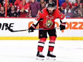 Erik Karlsson has missed a week of on-ice sessions at training camp, and coach Guy Boucher isn't holding his breath that his captain will be back any day soon.