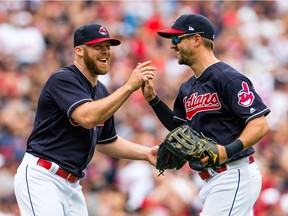 Closing pitcher Cody Allen #37 celebrates with left fielder Lonnie Chisenhall #8 of the Cleveland Indians who made the final catch to defeat the Detroit Tigers at Progressive Field on September 13, 2017 in Cleveland, Ohio. The Indians defeated the Tigers to win 21 straight games.