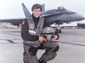 Dee Brasseur in front of her CF-18 fighter jet. Brasseur was among the first three women in Canada to earn her military wings.