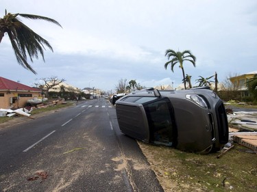 FRANCE-OVERSEAS-CARIBBEAN-WEATHER-HURRICANE

A photo taken on September 6, 2017 shows a car turned onto its side in Marigot, near the Bay of Nettle, on the French Collectivity of Saint Martin, after the passage of Hurricane Irma. France, the Netherlands and Britain on September 7 sent water, emergency rations and rescue teams to their stricken territories in the Caribbean hit by Hurricane Irma, which has killed at least 10 people. The worst-affected island so far is Saint Martin, which is divided between the Netherlands and France, where eight of the 10 confirmed deaths took place.  / AFP PHOTO / Lionel CHAMOISEAULIONEL CHAMOISEAU/AFP/Getty Images
LIONEL CHAMOISEAU, AFP/Getty Images