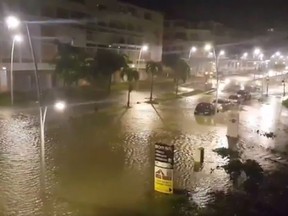 TOPSHOT-FRANCE-OVERSEAS-WEATHER-HURRICANE-CARIBBEAN TOPSHOT - This handout picture obtained from a video released on September 19, 2017, on the Twitter account of Yves Thole shows a flooded street in Pointe-a-Pitre after the powerful winds and rain of hurricane Maria battered the French overseas Caribbean island of Guadeloupe. Hurricane Maria strengthened into a "potentially catastrophic" Category Five storm as it barrelled into eastern Caribbean islands still reeling from Irma, forcing residents to evacuate in powerful winds and lashing rain. / AFP PHOTO / TWITTER / Yves THOLE / RESTRICTED TO EDITORIAL USE - MANDATORY CREDIT "AFP PHOTO / TWITTER / YVES THOLE" - NO MARKETING NO ADVERTISING CAMPAIGNS - DISTRIBUTED AS A SERVICE TO CLIENTS YVES THOLE/AFP/Getty Images RESTRICTED TO EDITORIAL USE - MANDATORY CREDIT "AFP PHOTO / TWITTER / YVES THOLE" - NO MARKETING NO ADVERTISING CAMPAIGNS - DISTRIBUTED AS A SERVICE TO CLIENTS YVES THOLE, AFP/Getty Images