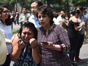 MEXICO-QUAKE

People react as a real quake rattles Mexico City on September 19, 2017 as an earthquake drill was being held in the capital. / AFP PHOTO / Ronaldo SCHEMIDTRONALDO SCHEMIDT/AFP/Getty Images
RONALDO SCHEMIDT, AFP/Getty Images