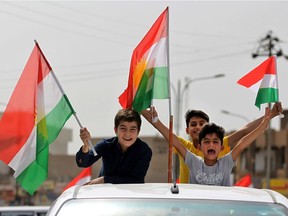 Iraqis Kurds celebrate with the Kurdish flag in the streets of the northern city of Kirkuk on Sept. 25 as they vote in a referendum on independence.