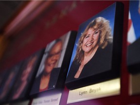 A picture of Sen. Lynn Beyak accompanies those of other on a display outside the Senate on Parliament Hill. Her views challenge some free speech defenders.