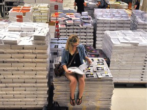 TUESDAY, AUGUST 30, 2011 PAGE A4 EDMONTON, ALBERTA: AUGUST 29, 2011 - Becky Barber, a second year university student in Animal Sciences, looks through a text book at the University of Alberta Bookstore on August 29, 2011. The bookstore is starting to become a hive of activity as most university students will be going back to class on September 7, 2011. (Photo by Larry Wong/Edmonton Journal) ORG XMIT: POS2015082113310613
Larry Wong Larry Wong, Larry Wong/Edmonton Journal