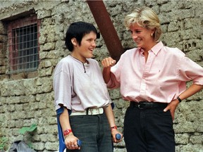 In this photo dated Sunday Aug. 10, 1997, Diana, Princess of Wales, right, chats with 15-year-old landmine victim Mirzeta Gabelic, in front of Mirzeta's home in Sarajevo, while Diana was on a visit to the region as part of her campaign against landmines.
