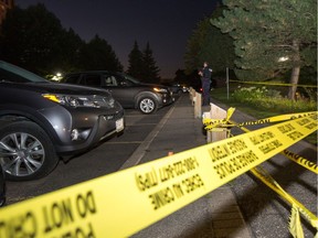 Ottawa police tape cordons off the scene of a police-involved shooting at 260 Brittany Dr. on Tuesday evening.  Wayne Cuddington/Postmedia