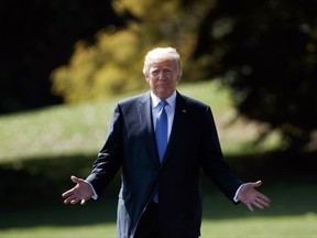 President Donald Trump walks to speak to reporters as he walks to board Marine One on the South Lawn of the White House, Wednesday, Sept. 27, 2017, in Washington.